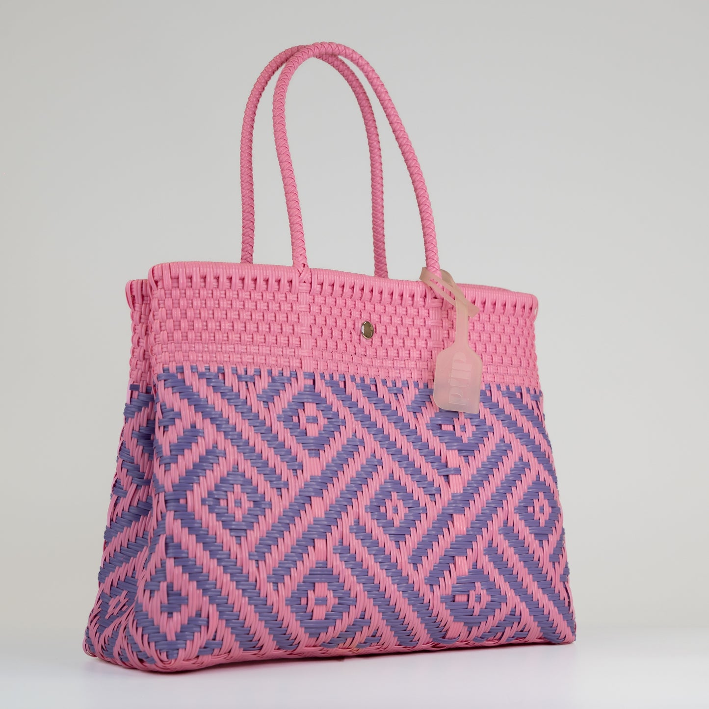 Sac à main motif aztèque en taille médium rose et lilas sur fond blanc