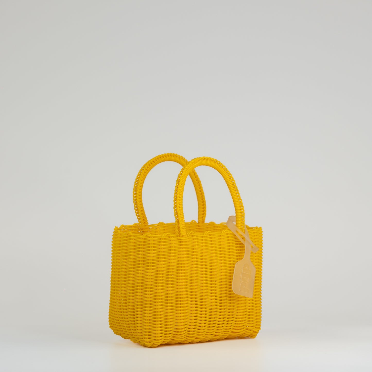 Panier Nëo en taille extra small jaune sur fond blanc