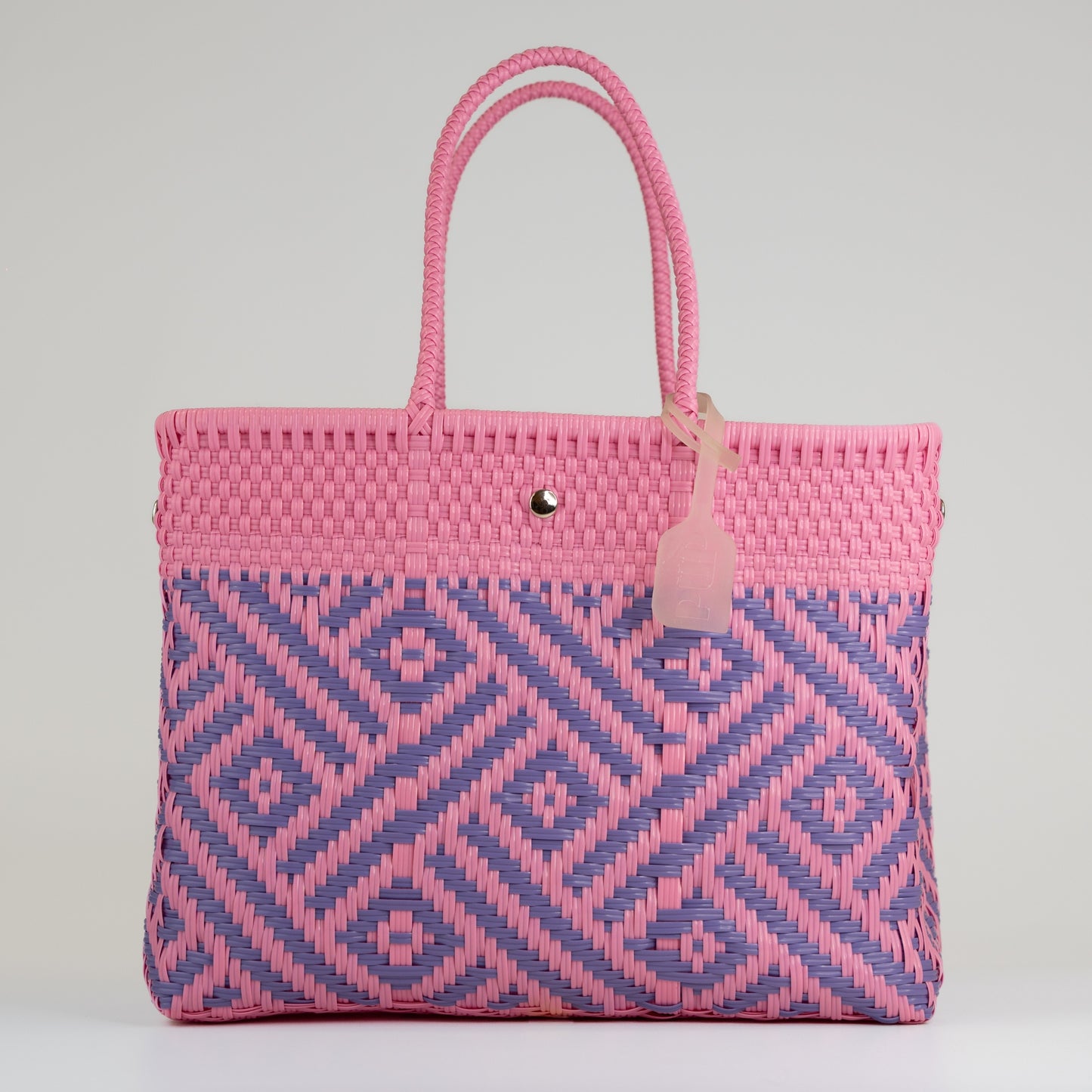 Sac à main motif aztèque en taille médium rose et lilas sur fond blanc 