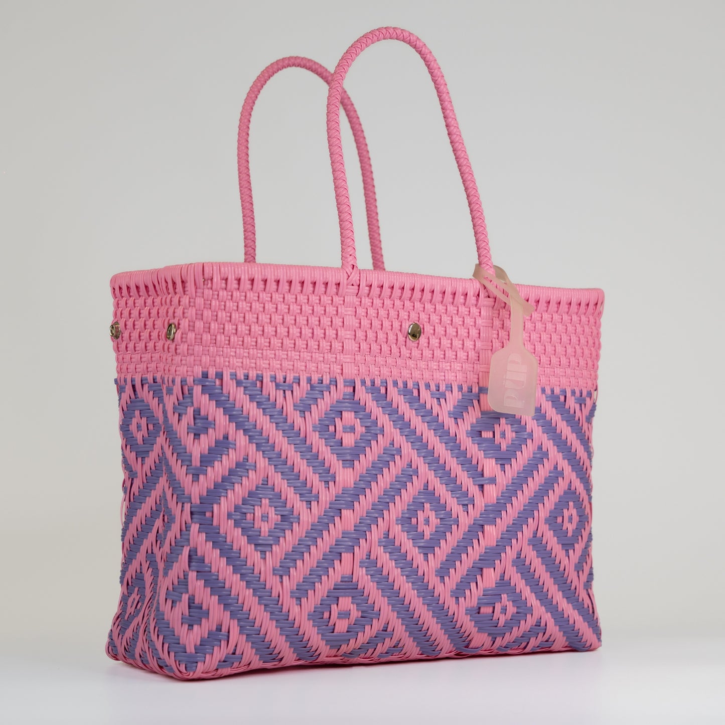 Sac à main motif aztèque en taille médium rose et lilas sur fond blanc 