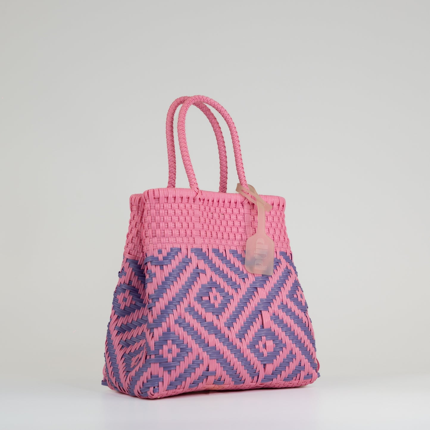 Sac à main motif aztèque en taille small rose et lilas sur fond blanc